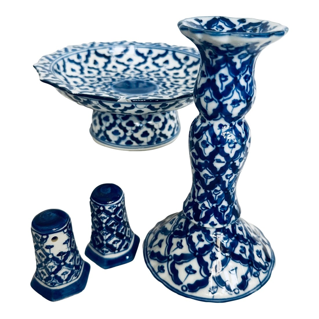 Set of 4 Blue & White Tableware Items: Vintage Blue & White set of a Footed Plate, candlestick and 2 salt/pepper shakers. These items showcase a classic blue and white pattern, reminiscent of Chinoiserie or Delftware, which is hand-painted