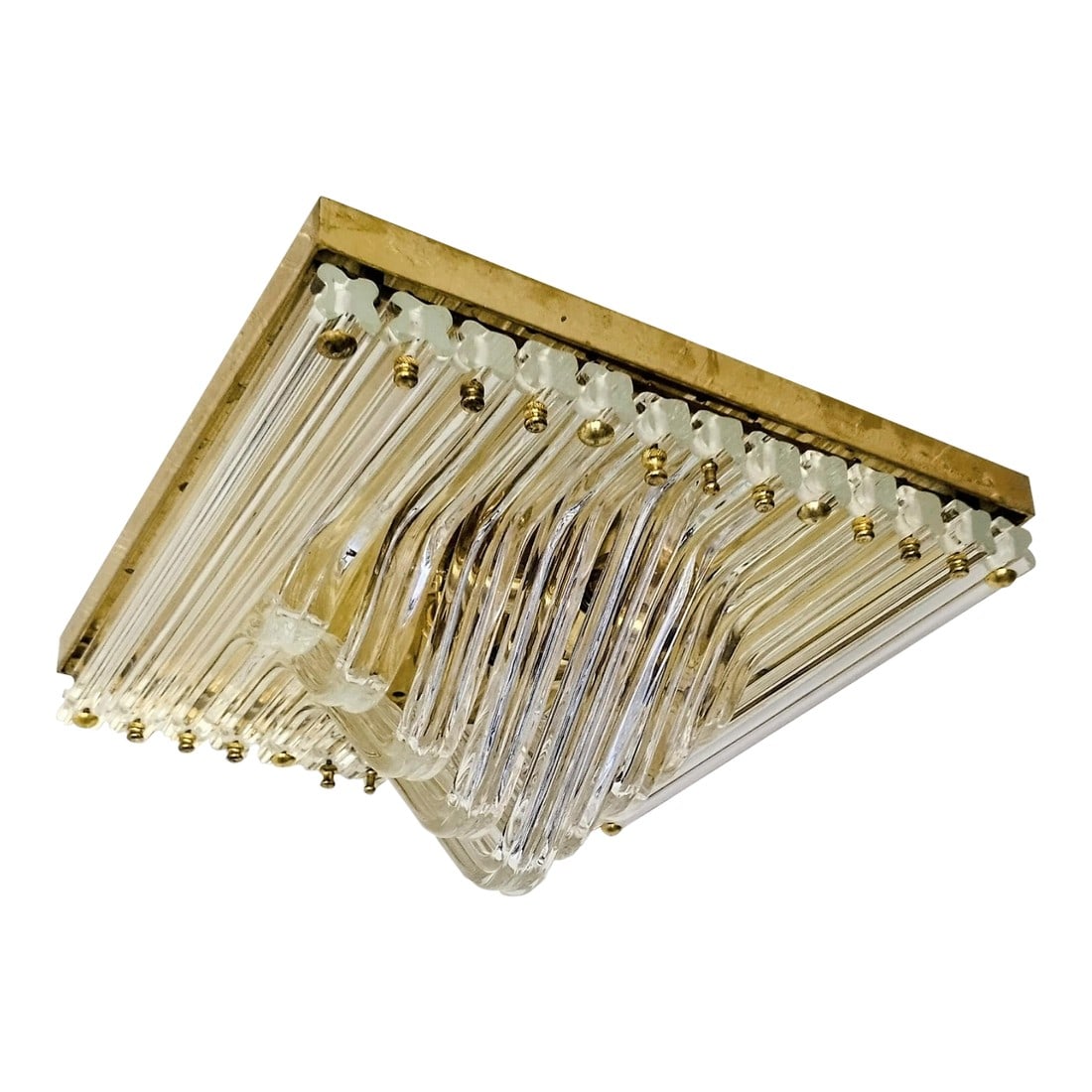 Murano Venini Styled Curved Quadriedri Crystal Glass Chevron Flush Mount in Brass, Italy, 1970s: Architectural and luminous, this Italian flush mount features layered chevron tiers of curved Murano quadriedri crystal glass prisms, mounted to a square brass ceiling plate. Each prism captures and