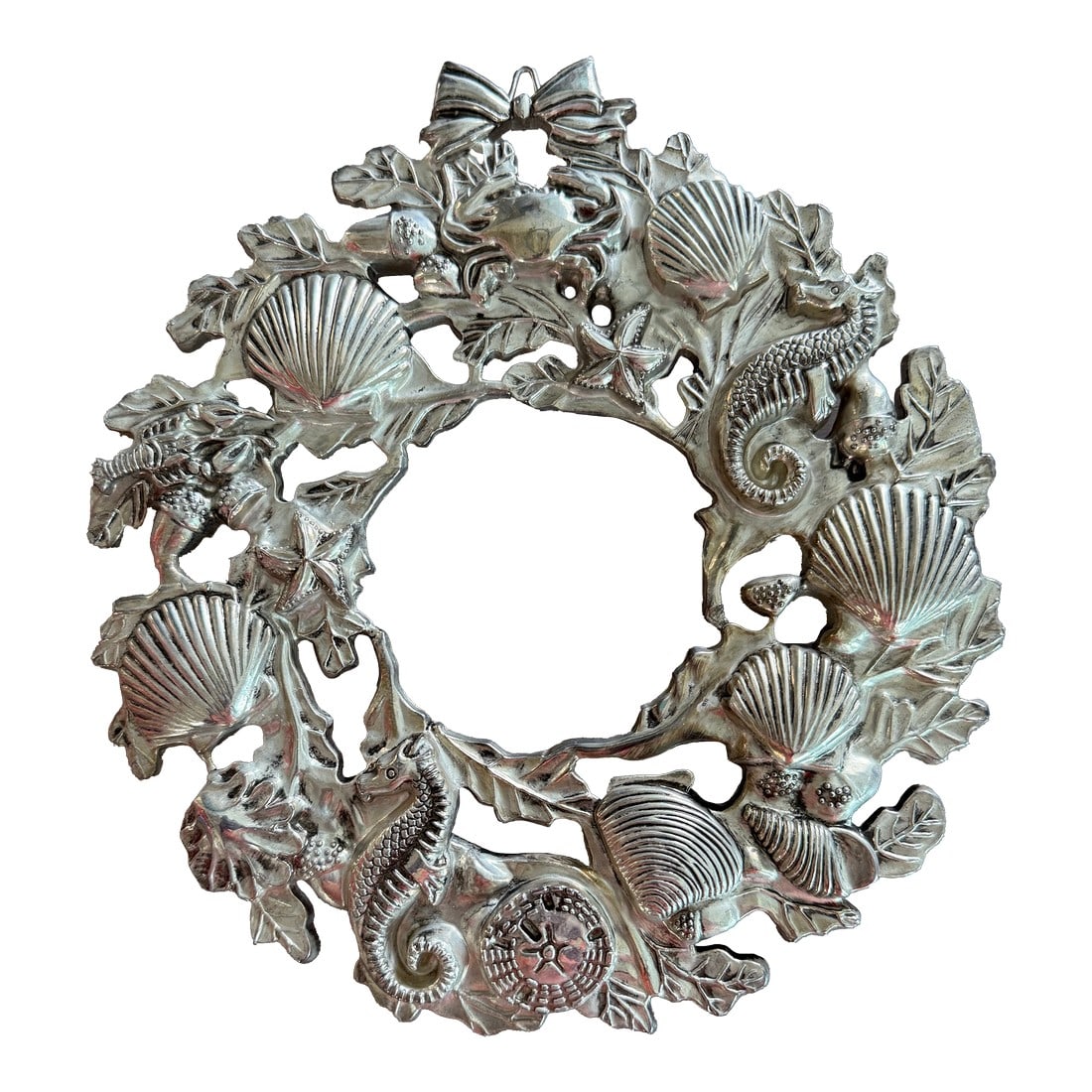 Vintage Silver Plate Coastal Wreath Trivet or Wall Hanging: Unique silver plate wreath adorned with seashells and seahorses that can be used as a wall hanging or a trivet. Can be displayed all year or use as a Christmas decoration. It has three legs with