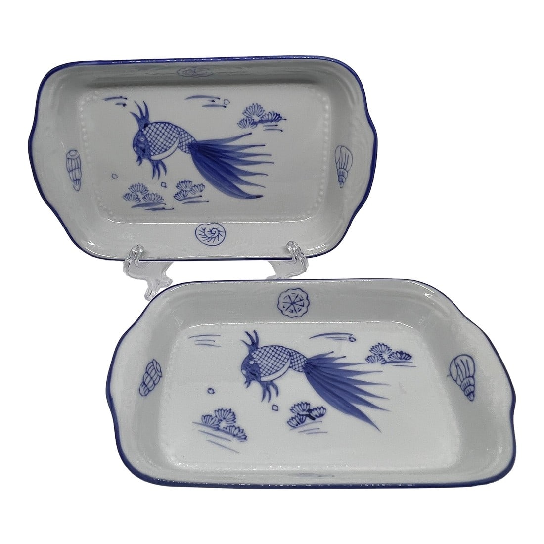 Vintage Rectangle Pottery Plate Blue & White Fish a Pair: Beautiful fish and seashells adorn these ceramic trays or plates. See the raised details around the edges and the dotted pattern along the bottom. This is a set of two. Condition: Alterations: Origina