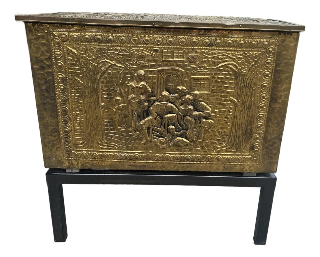 Mid 20th C Pressed Raised Brass Pub/Tavern Scene Firewood Kindling Storage Box on Stand: Here is a decorative and functional pressed brass lift lid box with a zinc liner and an added handmade iron base. The top and front have impressed scenes depicting a group who appear to be eating and