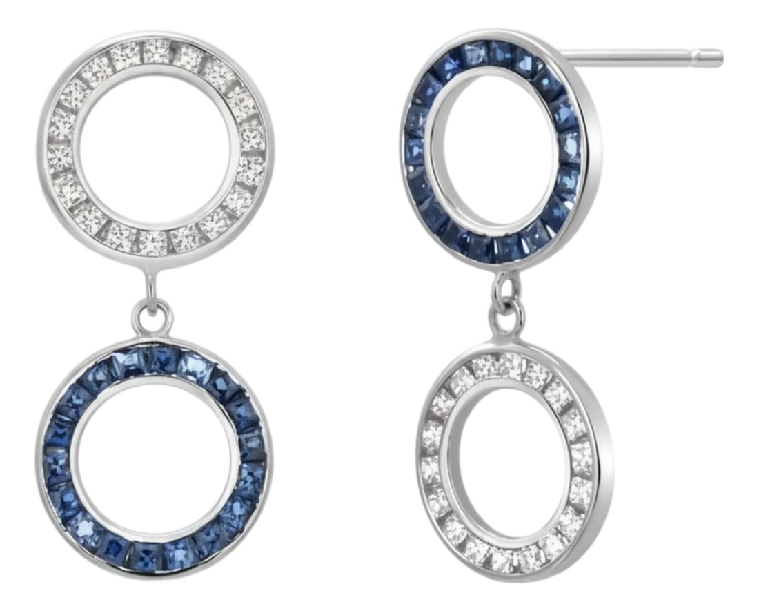 14k White Gold Double Circle Drop Earrings With Diamonds & Sapphires, A Pair: Handmade in the heart of New York's diamond district, these elegant double-circle drop earrings feature a rhythmic alternation of princess-cut diamonds (1.15 ctw) and vivid sapphires (1.65 ctw).