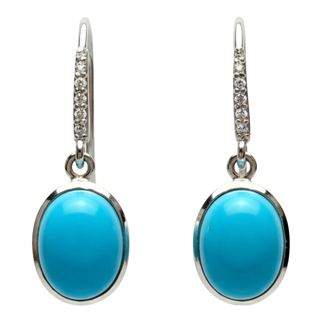 14k White Gold Oval Natural Turquoise & Diamond Shepherd Hoop Earrings, A Pair: Turquoise 6.90 Total Carats Diamonds 0.15 Total Carats 1.20" Length x 0.42" Width Elevate your fine jewelry collection with these refined 14K white gold shepherd hoop earrings, showcasing two vibrant