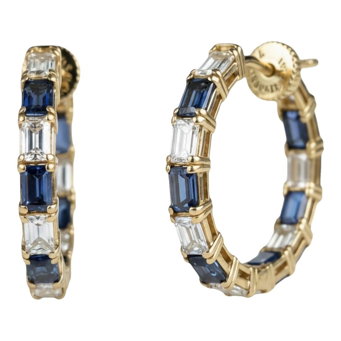 14k Yellow Gold Inside-Out Hoop Earrings With Baguette Sapphires and Diamonds, A Pair: Elevate a classic silhouette with a modern, high-luxury update. These 14K yellow gold inside-out hoop earrings feature a sophisticated twist-lock prong setting, showcasing baguette-cut gemstones set