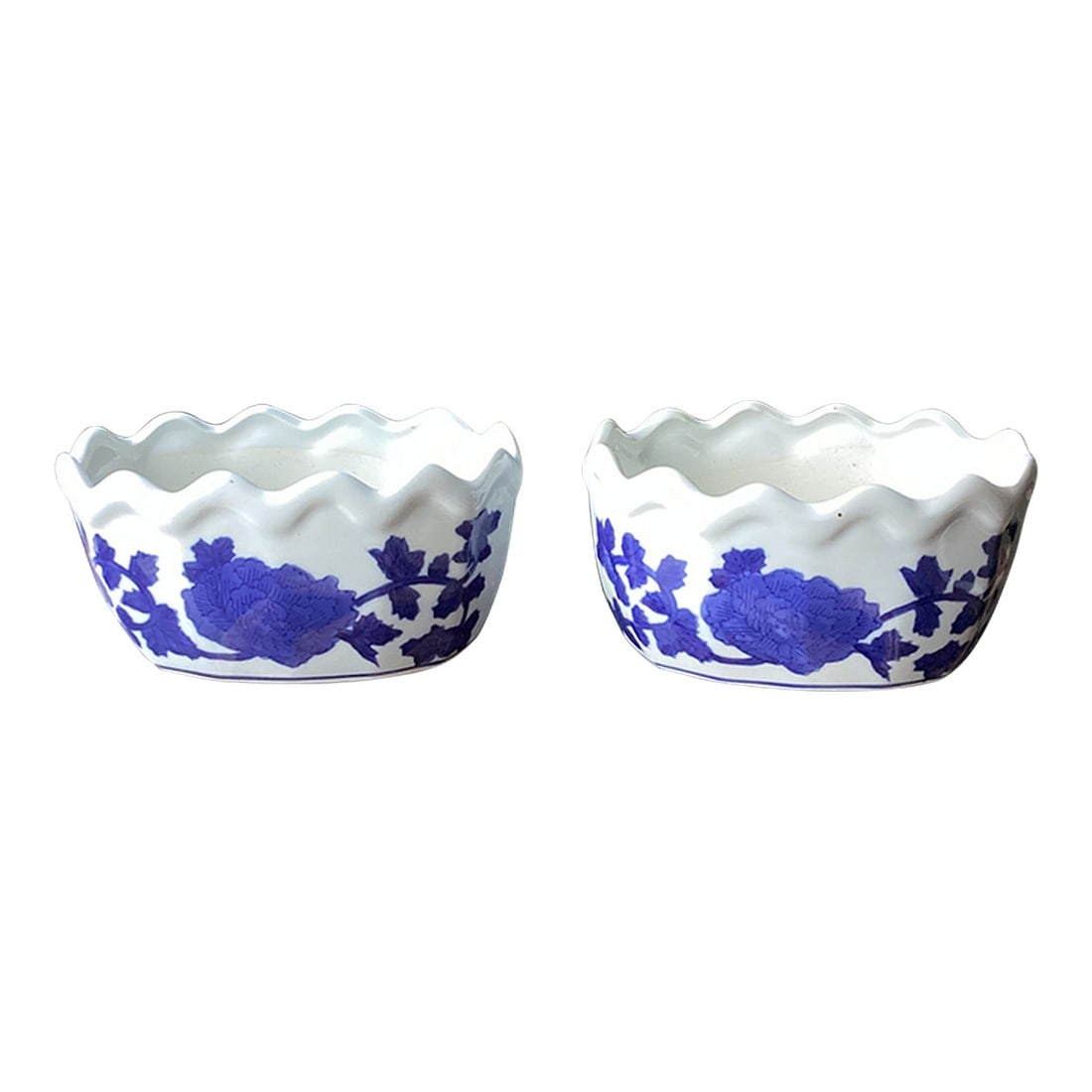 Mid 20th Century Pair of Italian Blue & White Porcelain Scalloped Cachepots: I bought these in Genoa Italy and brought them to US. Elegant pair of blue and white porcelain cachepots featuring bold cobalt floral decoration on a crisp white ground. The sculptural undulating