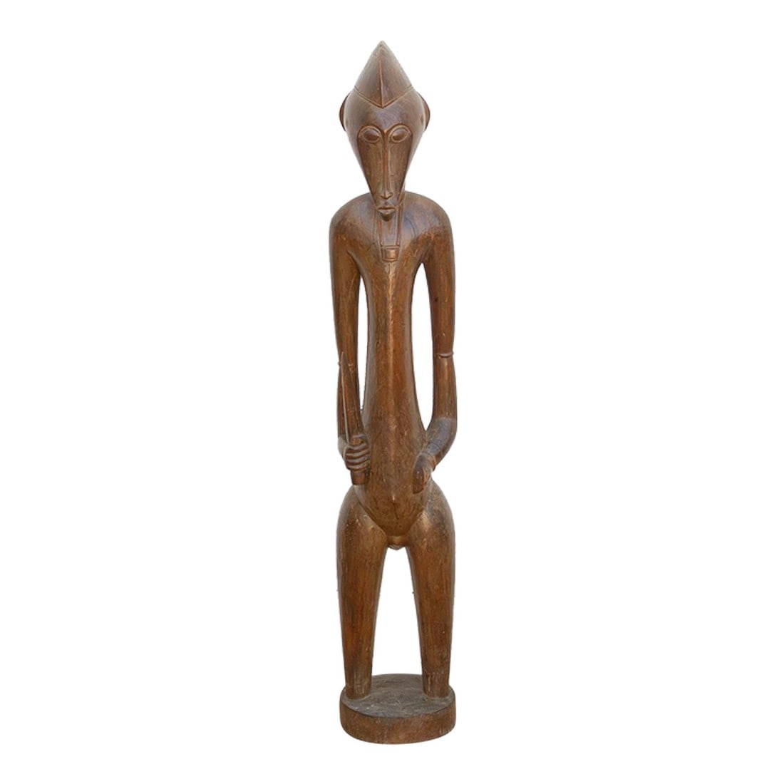 Refined Fang People Male Guardian Figure: This elegant 42-inch figure originates from the Fang people, who inhabit the rainforest regions of Gabon, Equatorial Guinea, and southern Cameroon. Historically, the Fang are renowned for their bieri"