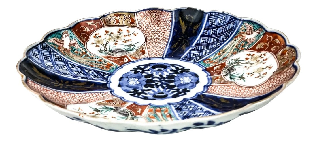1890s Japan Imari Scalloped Edge Bowl or Plate: Gorgeous fan design with all the traditional colors of Japan. The rim is a cool scallop curvy shape. The under-gaze blue is typical of the era. These very old plates in this condition are becoming mor