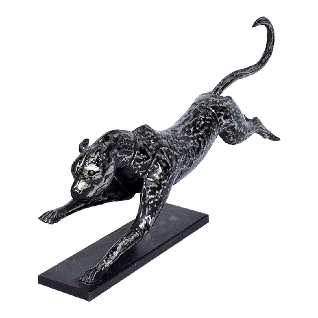 Cheetah Sculpture: This is an absolute beautiful, stunning running cheetah sculpture with black silver and bronze finish in this modern welded style. 45 " long, 22" high ( from the base to the end of it's tail ) 8"