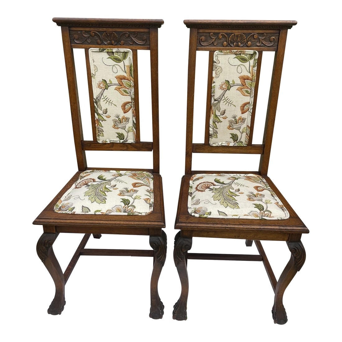 Late 19th Century Antique Carved Oak Claw Foot Side Chairs - a Pair: This pair of Jacobean carved oak side chairs was probably part of a set of dining chairs long ago. Our guess is that they come from England or Scotland. They feature the popular claw and ball feet and