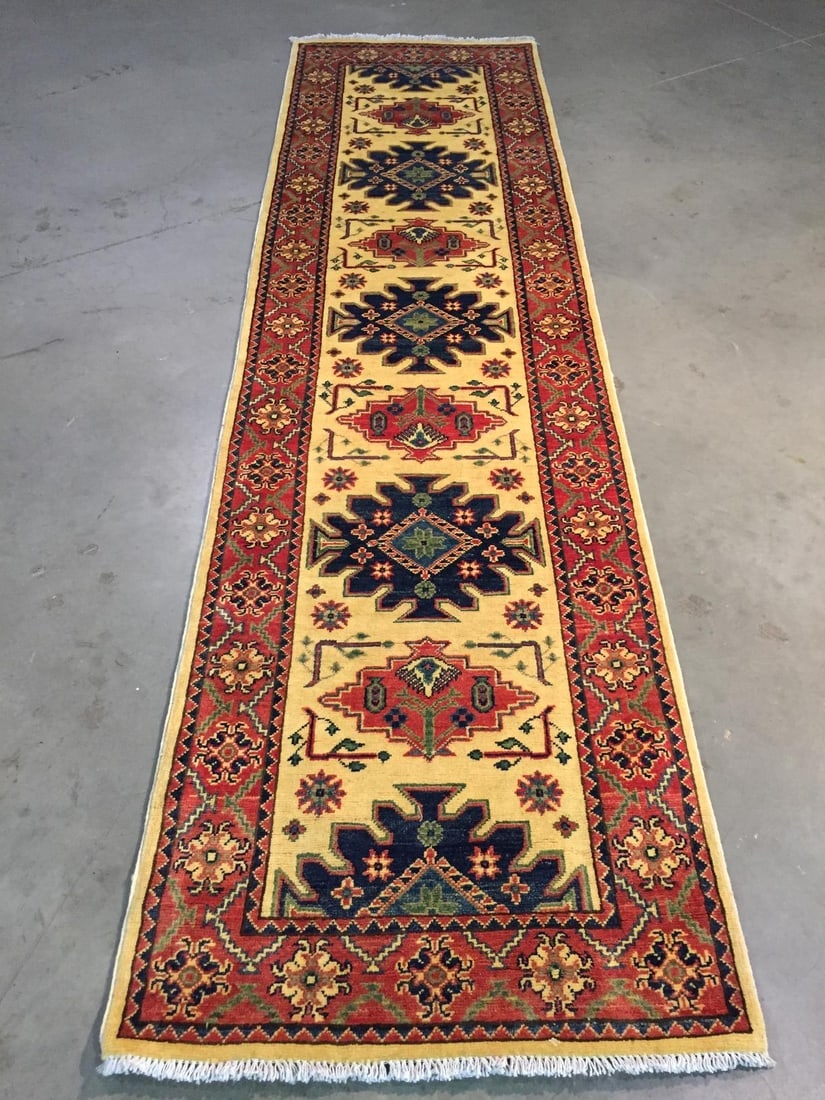 STUNNING FINE KAZAK RUNNER 2.8x10: Title:STUNNING FINE KAZAK RUNNER 2.8x10Description:2'.8"X10'.0" Super quality Kazak runner, hand spun and hand knotted rug in Pakistan 100% natural wool in Ivory, Navy , rustic red and multi accent