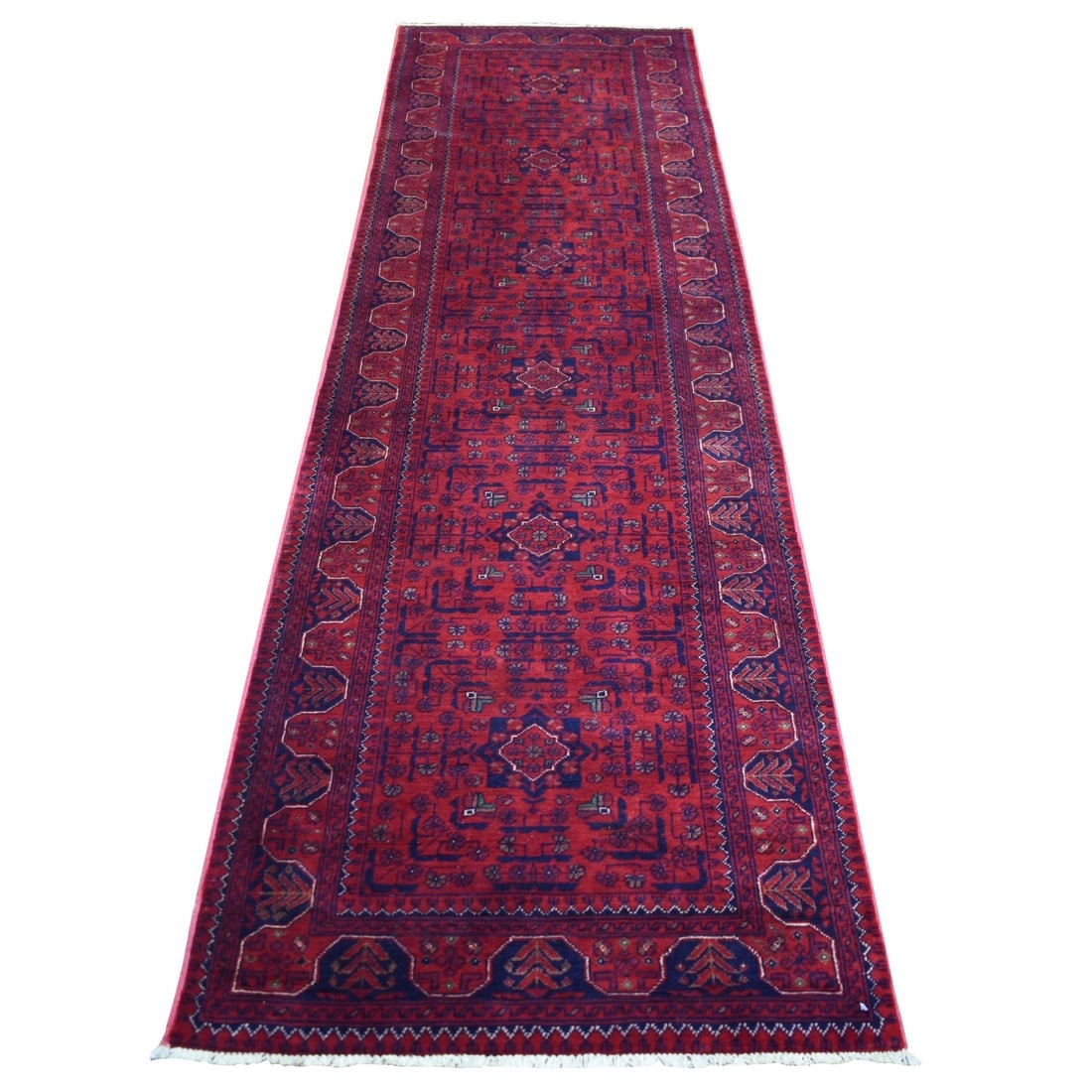 Red Hand Knotted Tribal Design Velvety Wool Afghan Khamyab Runner Rug: Title: Red Hand Knotted Tribal Design Velvety Wool Afghan Khamyab Runner RugDescription:This is a truly genuine one-of-a-kind. It has been Knotted for months and months in the centuries-old weaving
