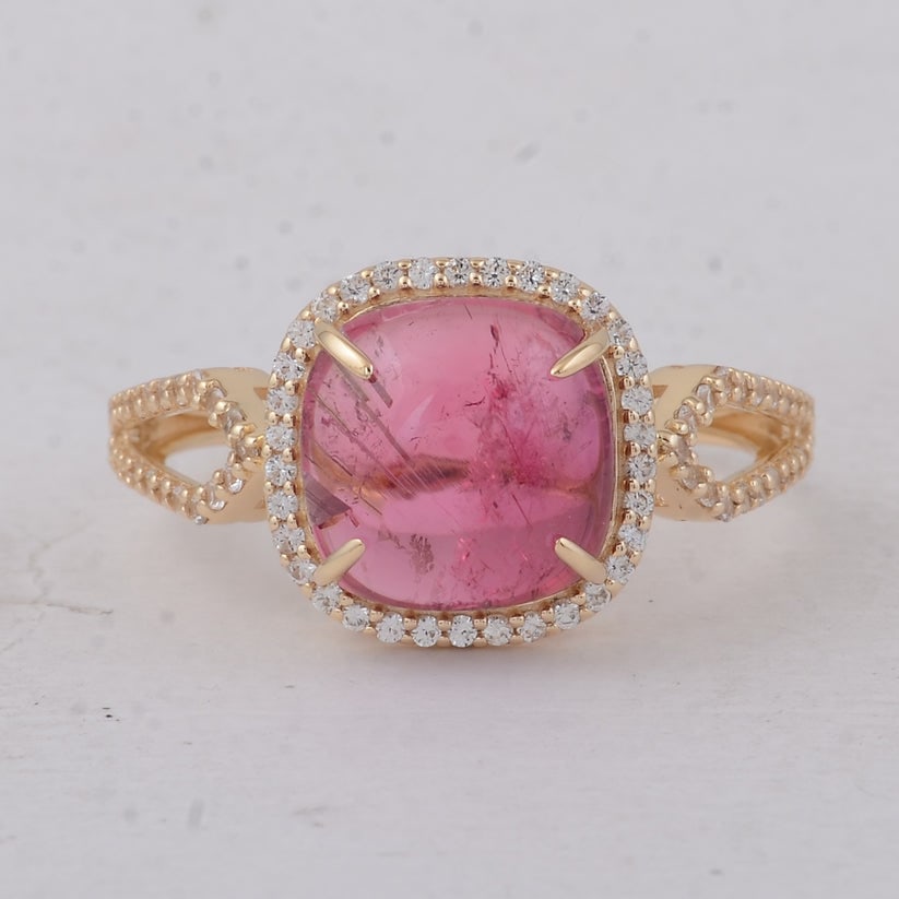 3.93 Ct Cushion Tourmaline 9K Gold Ring: 3.93 Total Carat Tourmaline 9K Gold Ring Specifications Total Weight 2.45 g Center Gemstone Tourmaline Gemstone Carat Weight 3.58 Carats Gemstone Measurements 9X9X4.70 mm Additional Gemstones White Sa