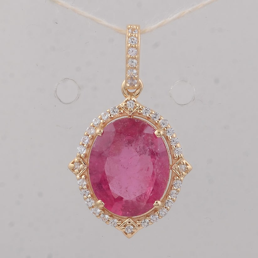 2.69 Ct Oval Tourmaline 9K Gold Pendant: 2.69 Total Carat Tourmaline 9K Gold Pendant Specifications Total Weight 1.43 g Center Gemstone Tourmaline Gemstone Carat Weight 2.54 Carats Gemstone Measurements 10X8 mm Additional Gemstones White Sap