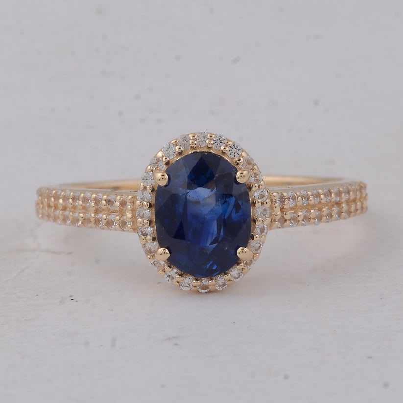 1.59 Ct Oval Sapphire 9K Gold Ring: 1.59 Total Carat Sapphire 9K Gold Ring Specifications Total Weight 1.902 g Center Gemstone Sapphire Gemstone Carat Weight 1.31 Carats Gemstone Measurements 7.40X5.70X3.50 mm Additional Gemstones White