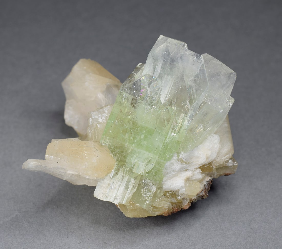Fine Apophyllite and stilbite on calcite: Title: Fine Apophyllite and stilbite on calciteOrigin: IndiaSize: 4 x 4 cmDescription: Fine Apophyllite and stilbite on calcite. Beautiful color and luster. Measurements: 4 x 4 cm Weight: 29 g 