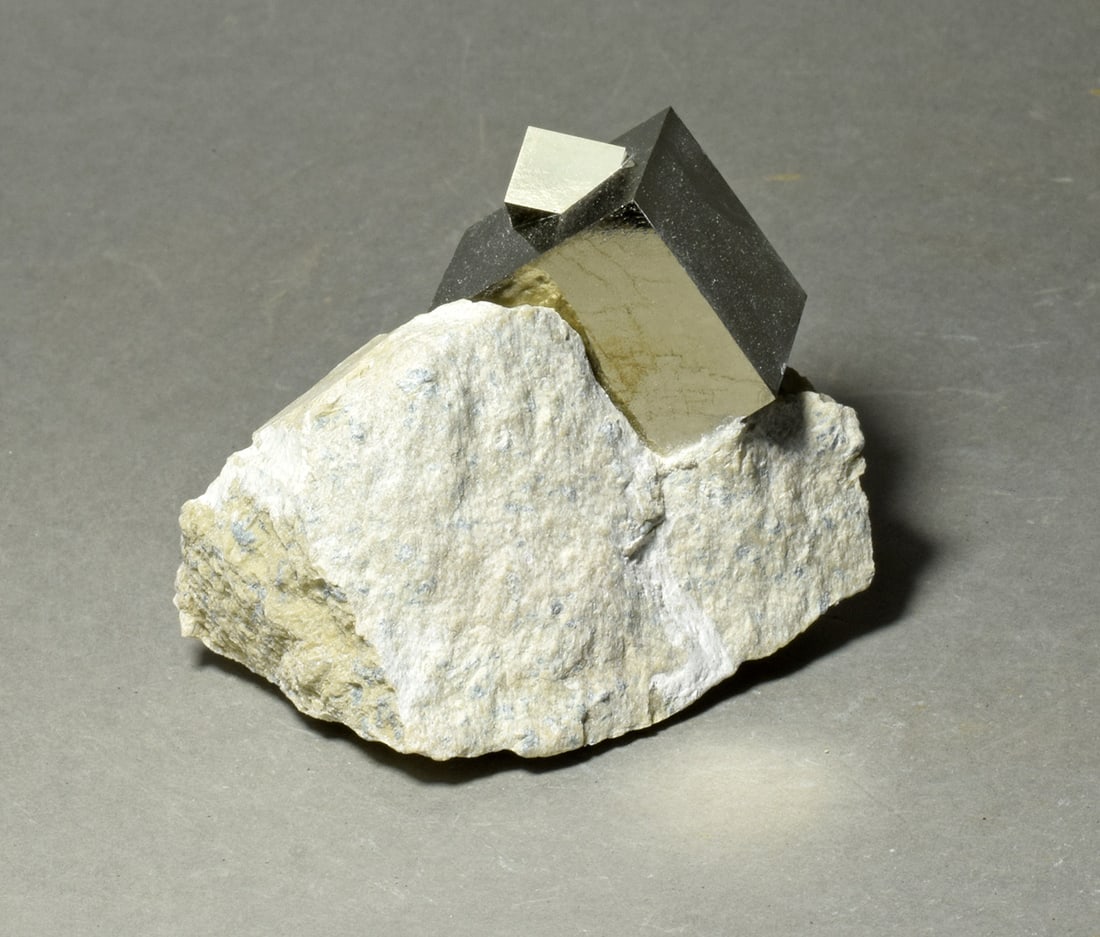 Beautiful Iron pyrite on matrix: Title: Beautiful Iron pyrite on matrix Origin: Spain Size: 24 x 24 x 23 mm main crystal Description: Beautiful natural iron pyrite cluster. Great luster and shape. Very decorative. One gluing present