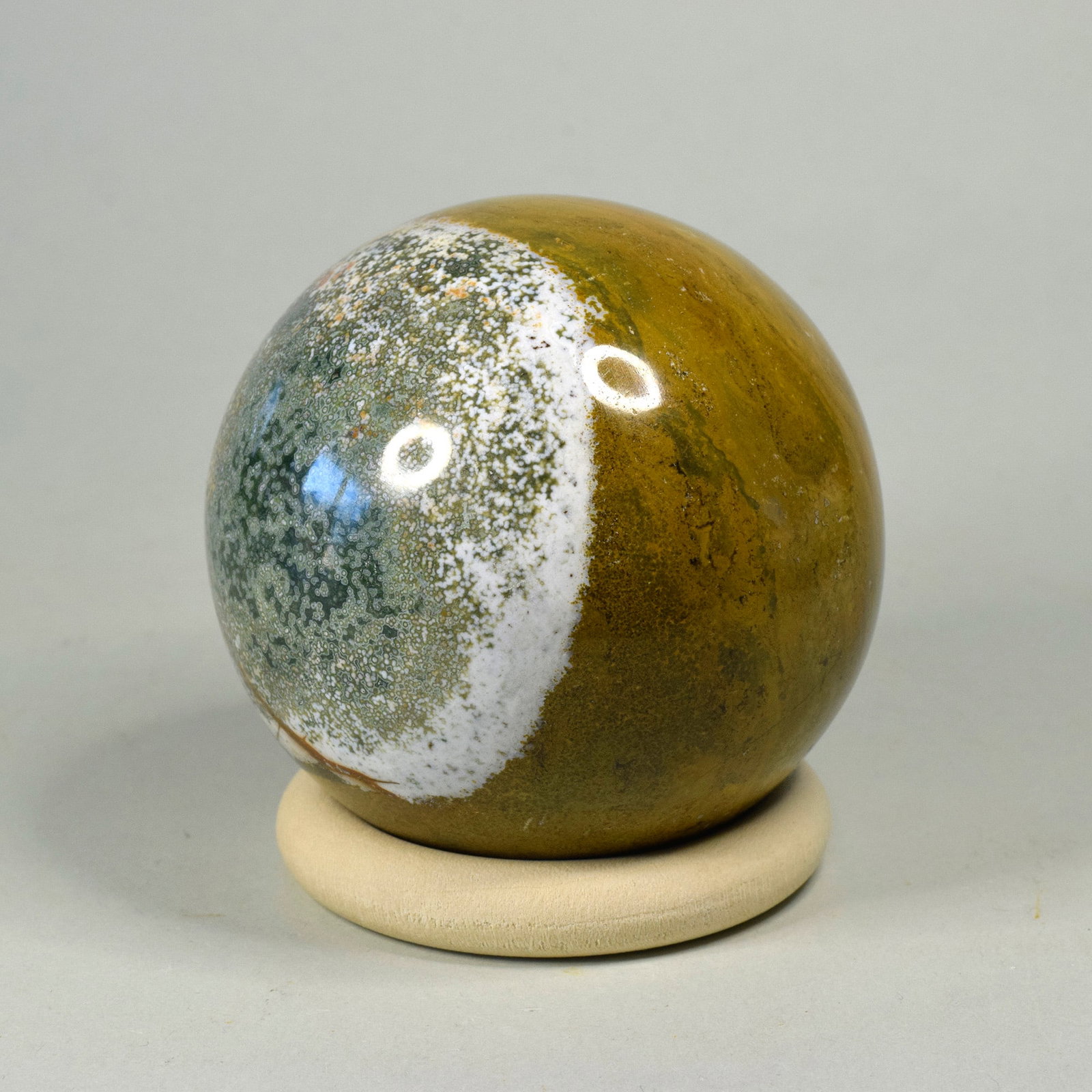 6.7 cm Polished Ocean Jasper sphere: Title: 6.7 cm Polished Ocean Jasper sphere Origin: Madagascar Size: 6.7 cm diameter Description: Species: Jasper (Ocean Jasper) Locality: Madagascar Diameter: 6.7 cm Weight: 0.39 kg Fine polished ocea