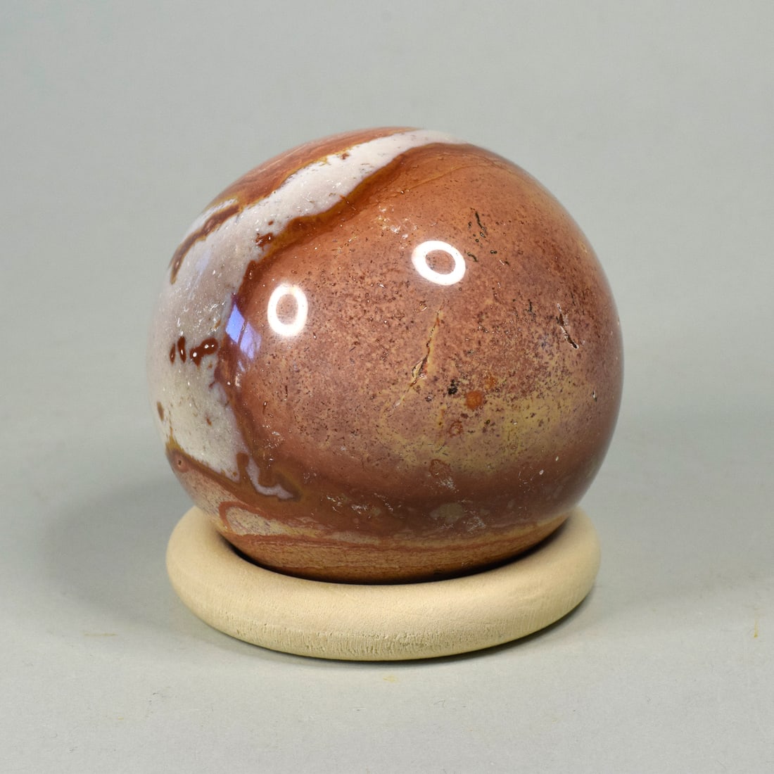 Gorgeous 5.9 cm Polished Polychrome Jasper sphere: Title: Gorgeous 5.9 cm Polished Polychrome Jasper sphere Origin: Madagascar Size: 5.9 cm diameter Description: Species: Jasper (Polychrome Jasper) Locality: Madagascar Diameter: 5.9 cm Weight: 0.28 kg