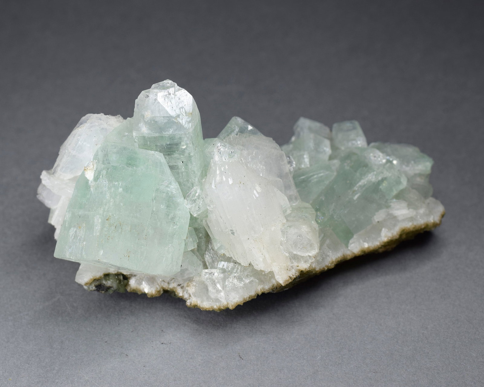 Fine Apophyllite on matrix: Title: Fine Apophyllite on matrix Origin: India Size: 7 x 4 cm Description: Fine Apophyllite on matrix. Beautiful color and luster. Weight: 59 g Reserve: $80.00 Shipping: Domestic: Flat-rate of $60.00