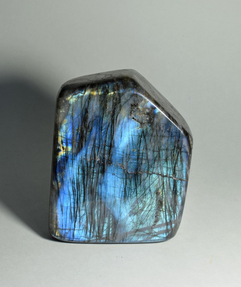Striped blue labradorite freeform: Title: Striped blue labradorite freeformOrigin: MadagascarSize: 11.1 x 8.8 x 3.9 cmDescription: Mineral: Labradorite Locality: Madagascar Measurements: 11.1 x 8.8 x 3.9 cm Weight: 0.87 kg Fine