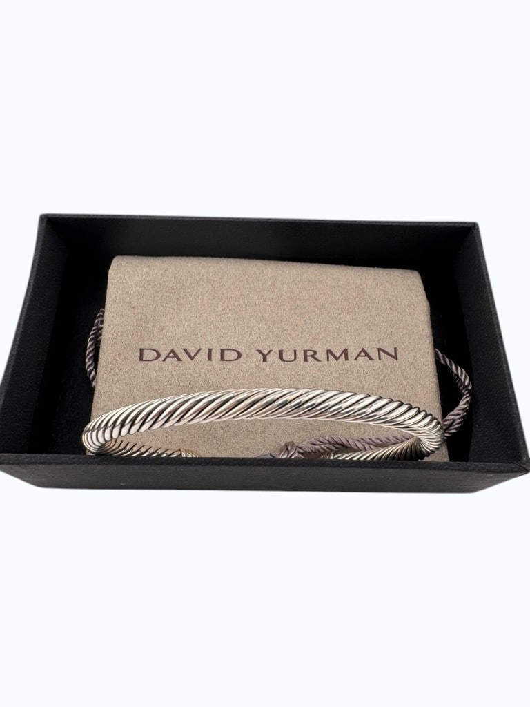 David Yurman Sterling Silver 925 Cable Classics Pave Diamond Cuff Bracelet: This elegant David Yurman Sterling Silver 925 Cable Classics cuff bracelet features the iconic twisted sterling silver cable design, accented with end caps pave-set with round brilliant-cut diamonds.