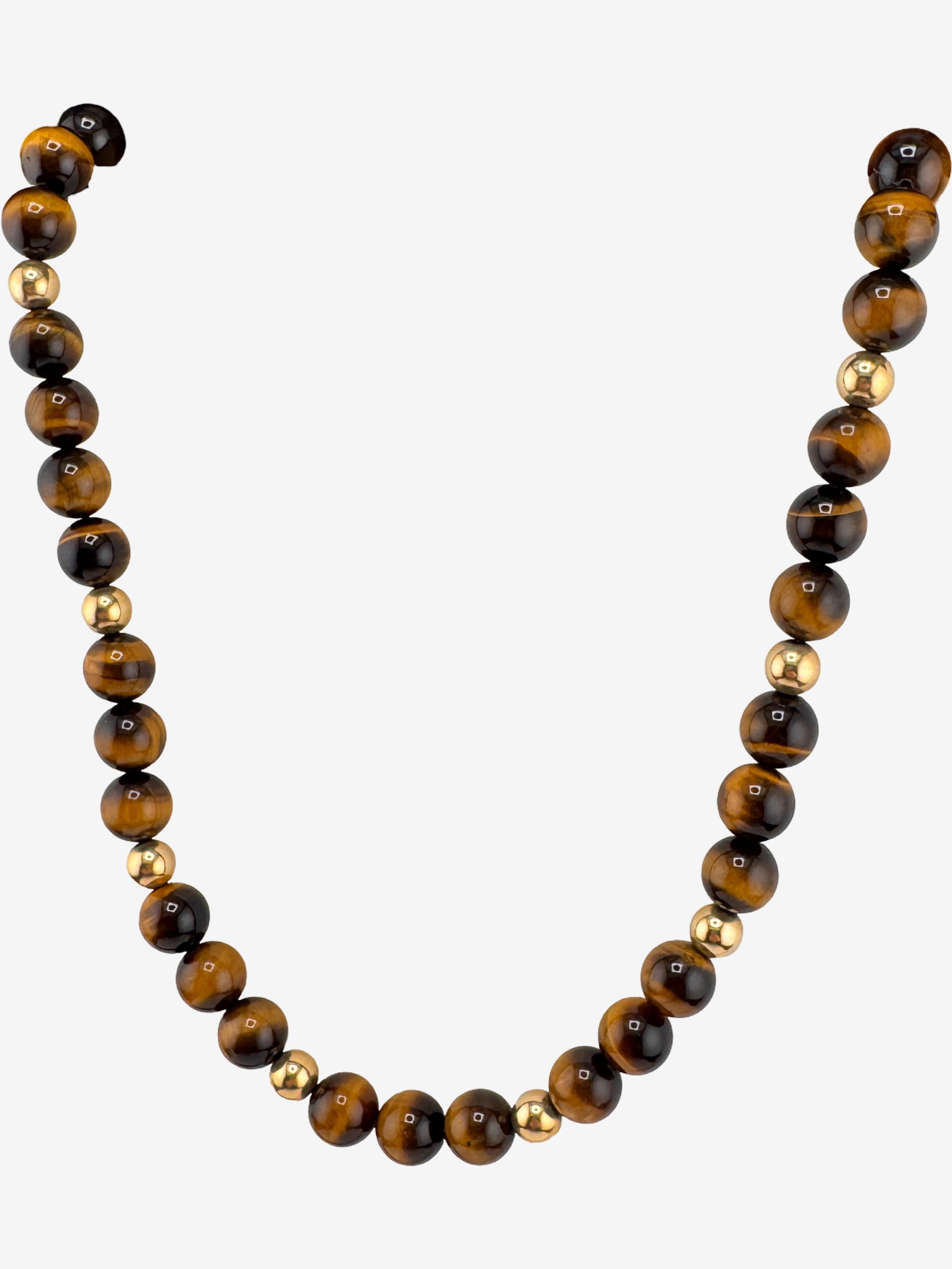 Tiger's Eye and Gold Tone Beaded Necklace: This elegant necklace features polished round beads of tiger's eye, showcasing their characteristic chatoyancy and rich brown and golden hues. These natural stone beads are interspersed with smaller,