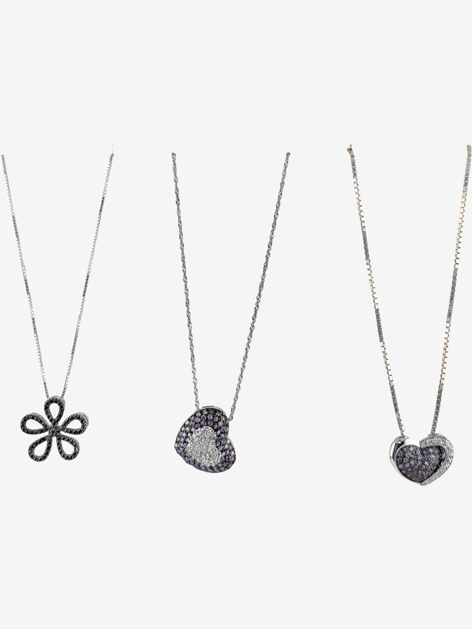 Sterling Silver Gemstone Pendant Necklace Lot Ð Heart & Floral Designs 14ÓÐ16Ó: Attractive lot of three sterling silver pendant necklaces featuring delicate floral and heart motifs with sparkling accent stones. This grouping includes two heart-shaped pendants set with purple