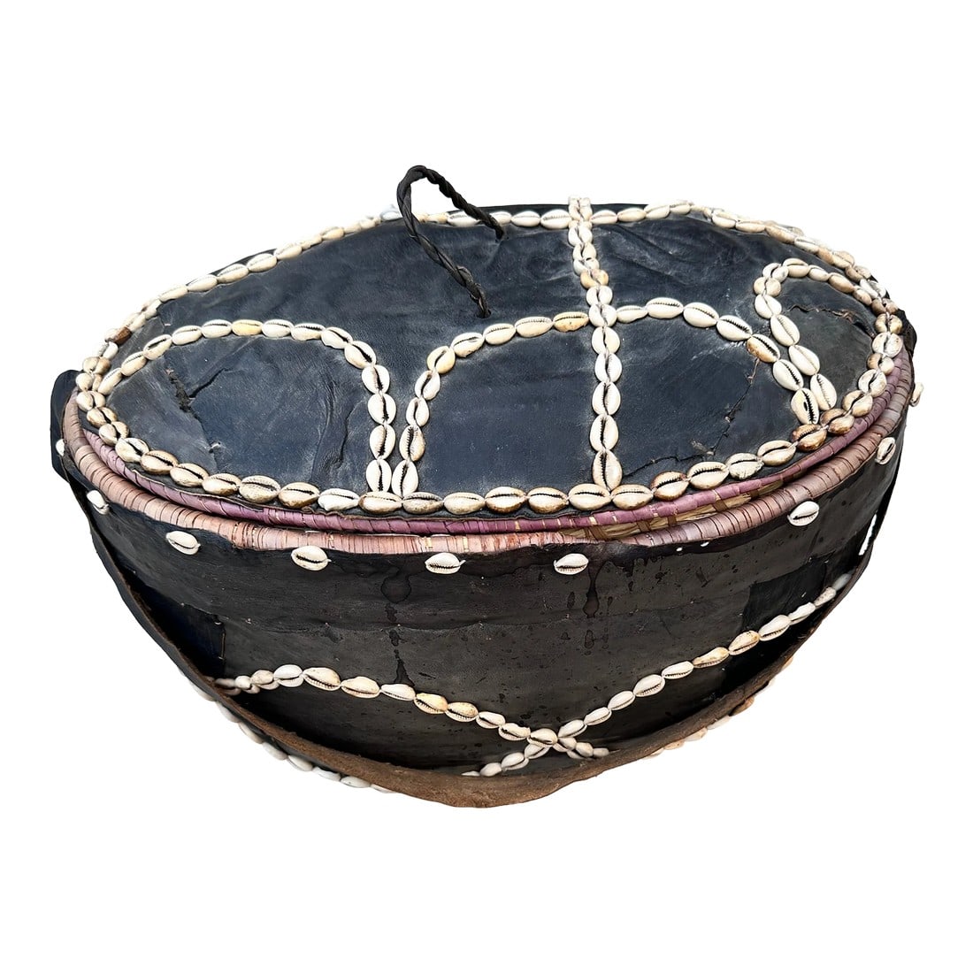 Mid 20th Century Leather Covered Cowrie Shell-Stitched Woven Basket With Carrying Strap: Beautifully decorated lidded basket with cowrie shell stitching- a large handcrafted carrying basket. Woven grass with leather outer coverings, leather shoulder strap, and a braided leather handle. 