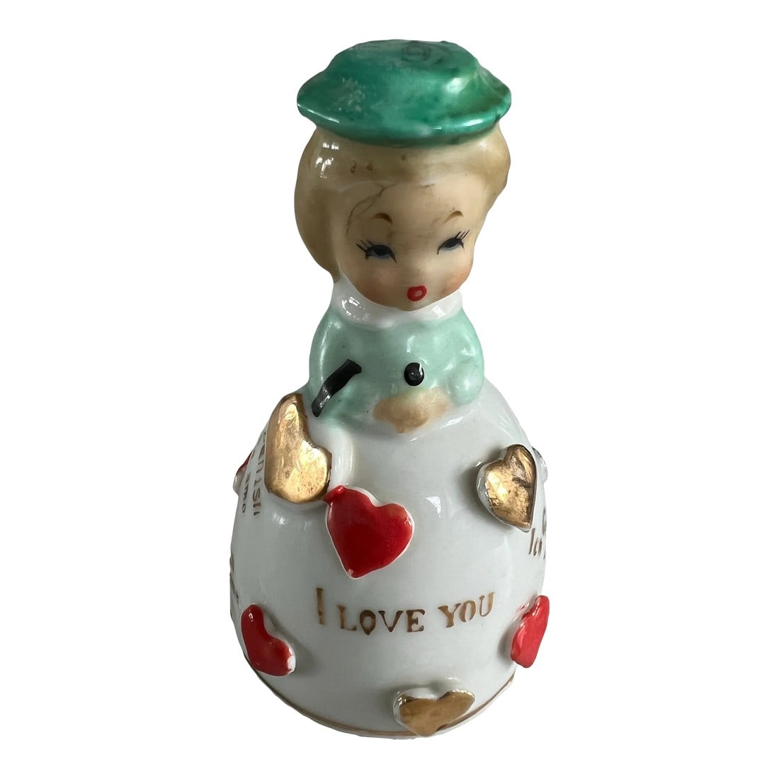 1950s I Love You Bell: Vintage bell in the shape of a young girl. Her skirt is adorned with raised hearts and the words "I Love You" in several languages. English, German, Italian, Portuguese, Chinese, Spanish and French