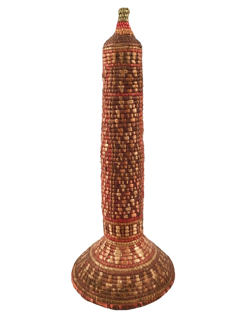 Early 20th Century Woven Basket Sculpture: Ethiopian Basket sculpture with a single coil built up of reeds and woven natural dyed grasses as the shape builds a beautiful form. A decorative pattern in tones of red, maize and sienna. Hollow
