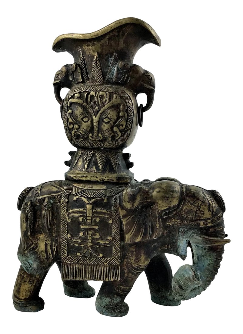 1920's Vintage Solid Brass Carved Elephant Vase: A very heavy old brass Elephant Vase which has begun the tarnish process. Not to worry. It actually adds value to this type of unique item. Hand carved from wood and then made with casting brass.