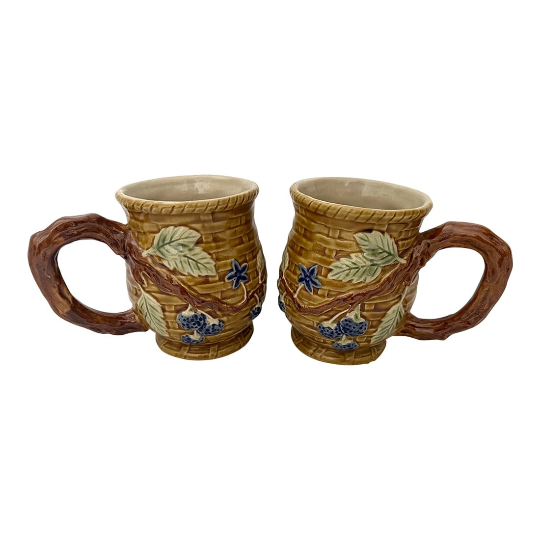 Vintage Set of 2 Majolica Blueberries/Basketweave Mugs: Vintage set of 2 Majolica Blueberry & basketweave relic with a branch handle. 5.5in w x 4.5in h x 3.5in diameter Make sure to follow me, I have flash sales for my follower only D2 Condition: Alteratio