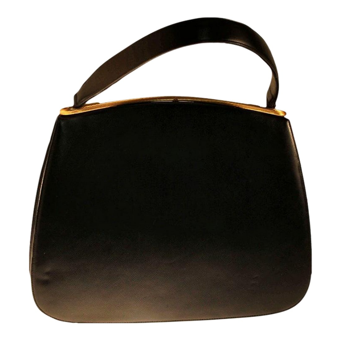 1960's Dorian Textured Black Leather Kelly Bag: This purse is a rare one indeed. The leather has a very subtle texture in a criss-cross design that gives this purse the look of elegance. The clasp is a very unusual curvy shape and clicks shut