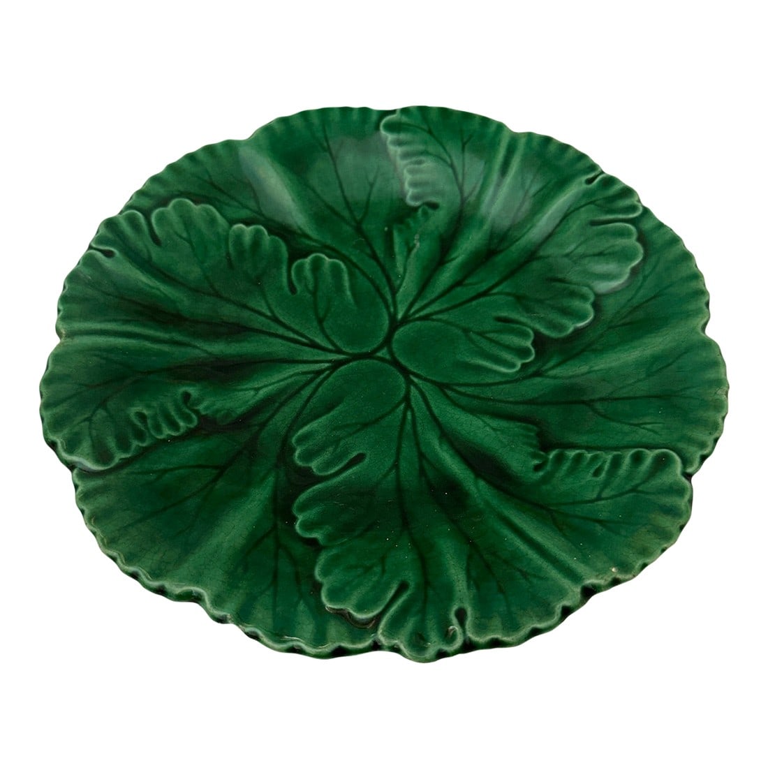 French Majolica Glazed Green Leaf Plate: Beautiful French Regal Sanjouand, Clairfontaine, a green Majolica glazed overlapping leaf plate. The mold shows leaves with incised veining terminating in a shaped rim. The glaze pools beautiful into