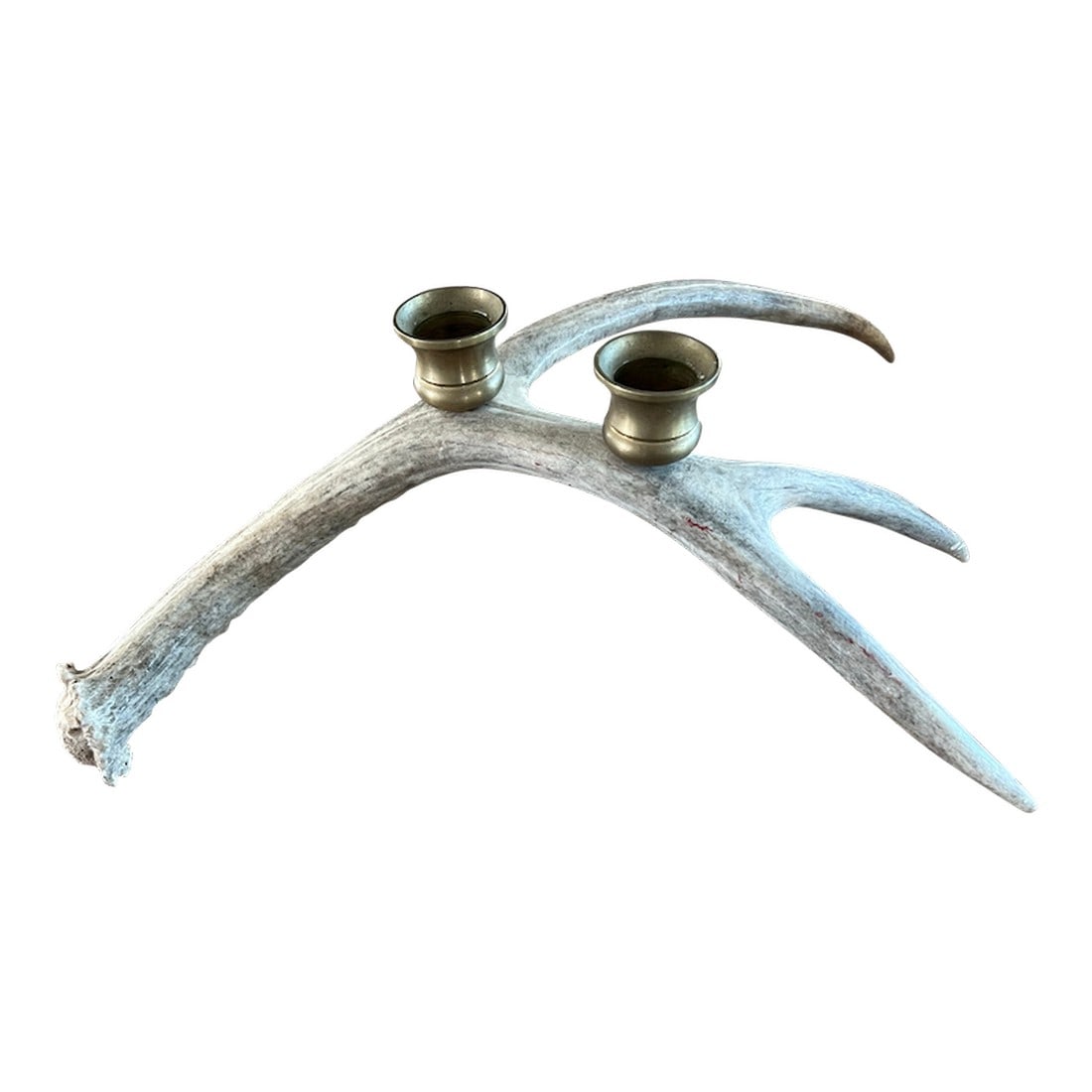 Vintage Natural Drop Deer Antler Candelabra: Vintage natural shed deer antler with brass candle holders. Add a bit of rustic charm to your home with this beautiful piece of nature. Condition: Alterations: Original Condition Unaltered