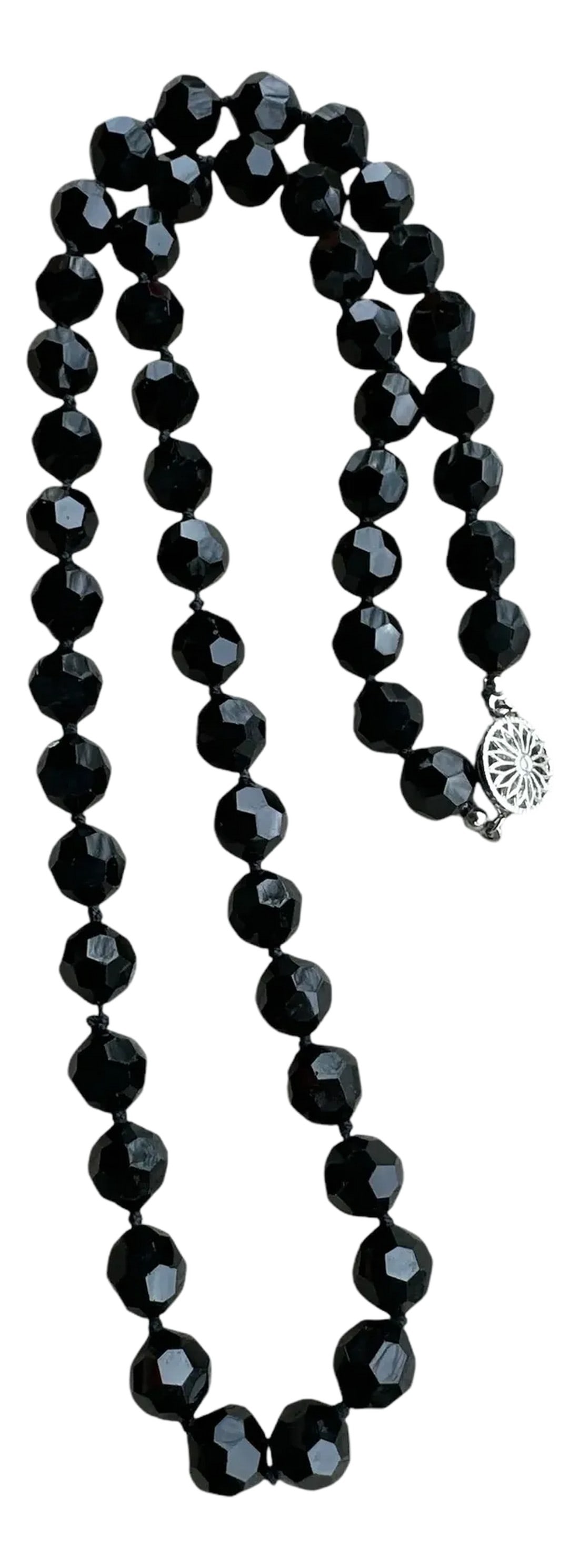Vintage Black Faceted Glass Beaded Necklace: Vintage Black Faceted Glass Beaded Necklace Hand-tied to a decorative silver tone round box clasp. 24" in total length with 52 glass beads Unsigned Late 20th century-1980's Excellent vintage condition