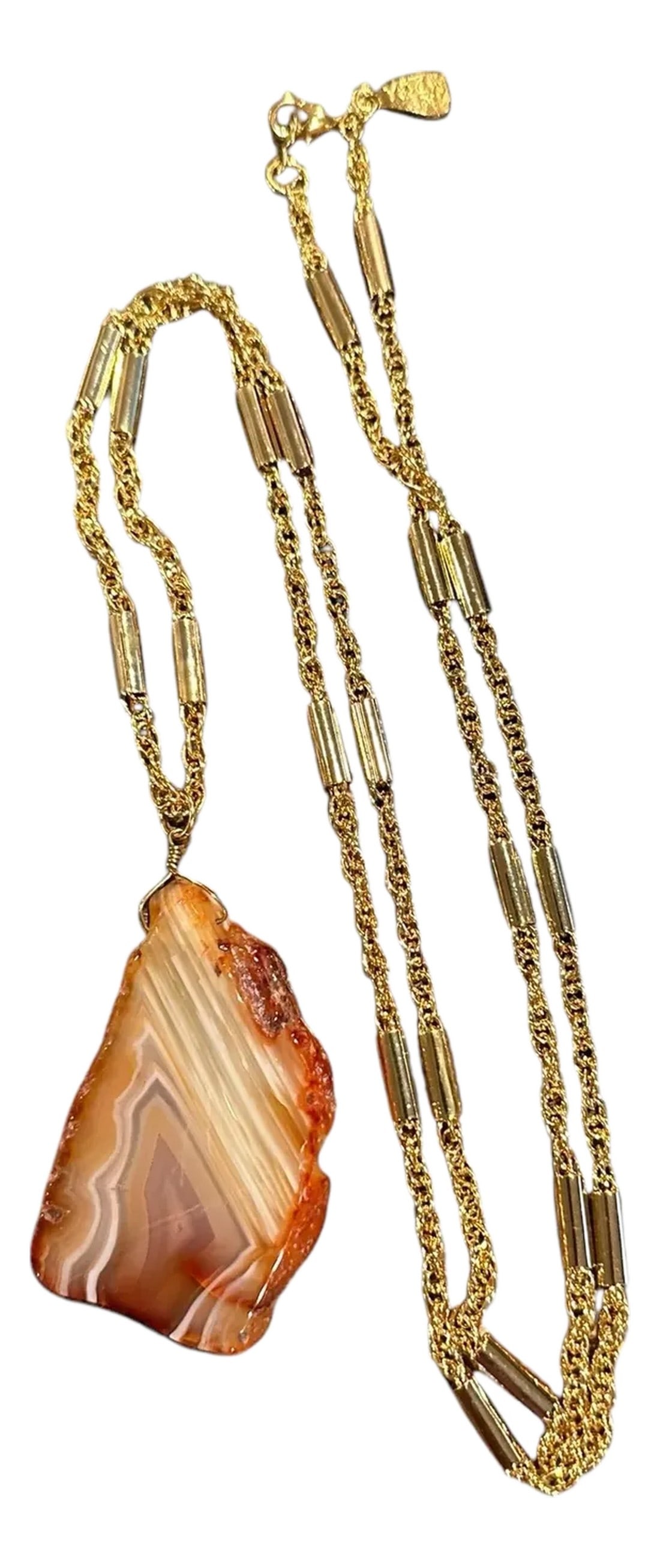 Late 20th Century Signed Yochi New York Natural Agate Slab Gold Tone Necklace: Natural Agate Slice Pendant on long chain. Pendant measures 2.5" long x 1.625" wide x 25" wide Including the chain measures 23" long Marked YOCHI NY Circa 1990's Condition notes: Excellent. The