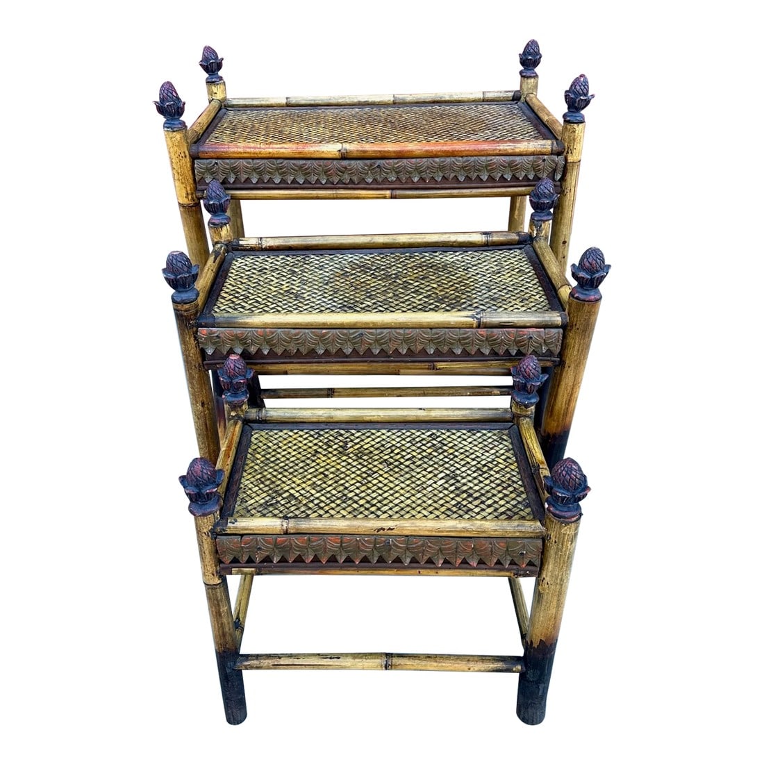 Vintage Bamboo & Woven Rattan Nesting Tables: Vintage Bamboo & Woven Rattan Nesting Tables a set of 3. Rattan tops with bamboo structures with pineapple finials. Has a tin boarder. Perfect for a covered patio or pool area. Large- 22.5in h x 18in