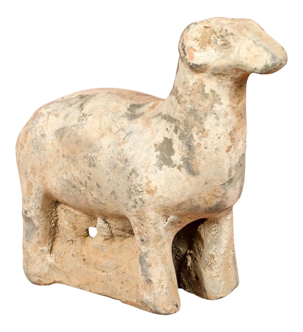 Small Chinese Han Dynasty Terracotta Sheep Mingqi, circa 202 BC-200 AD: A petite Chinese Han Dynasty terracotta sheep Mingqi circa 202 BC-200 AD. Created in China during the prestigious Han Dynasty, this ancient terracotta sculpture features a sheep standing in an alert