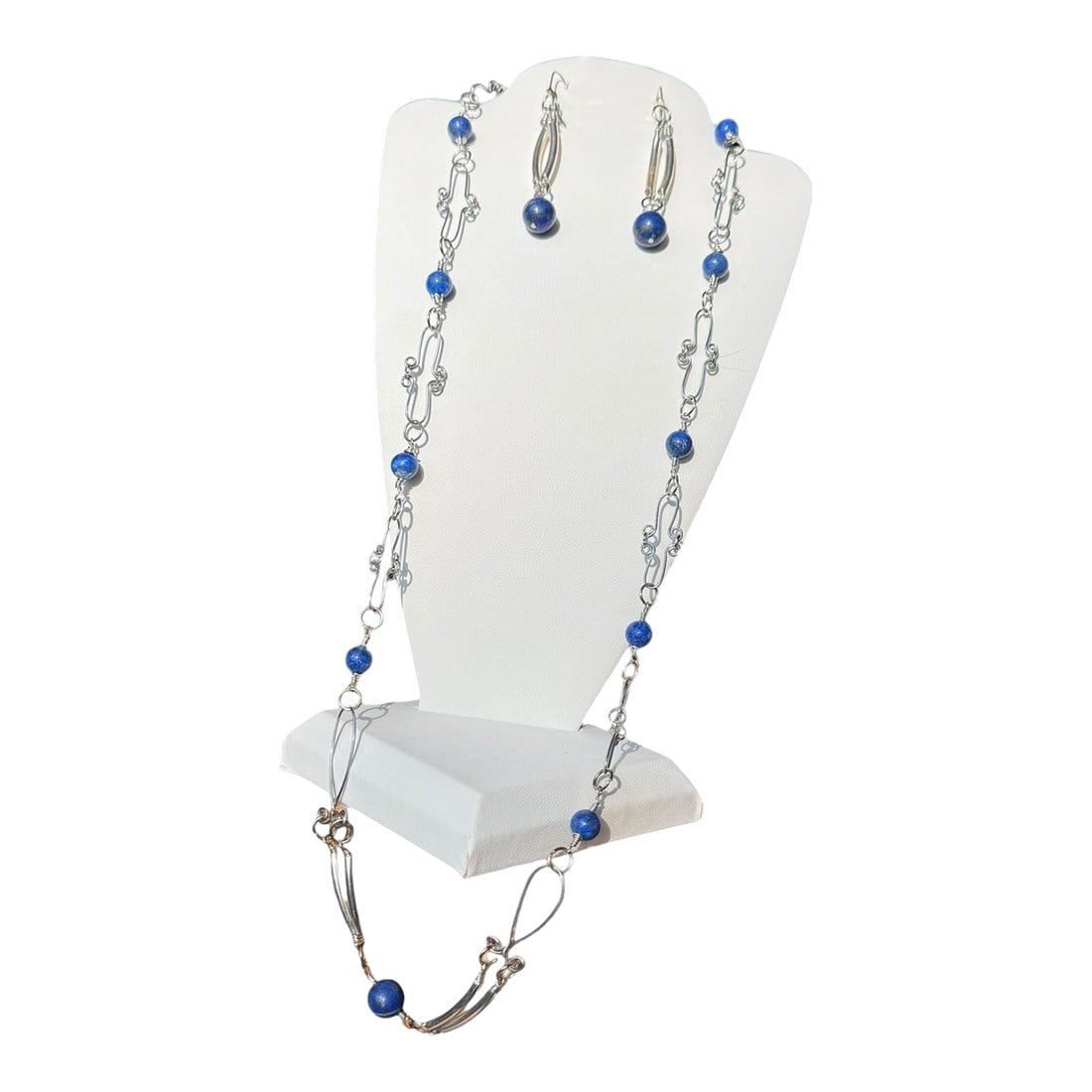 1990s Sterling Silver Lapis Lazuli Necklace Earrings Set - 3 Pieces: Beautiful lapis lazuli beads artfully wired with curved bars. Dangle earrings marked 925 on a lever back hinged clasp. Earrings 2" long Necklace 14" long -No clasp - place over the head Condition: Alt