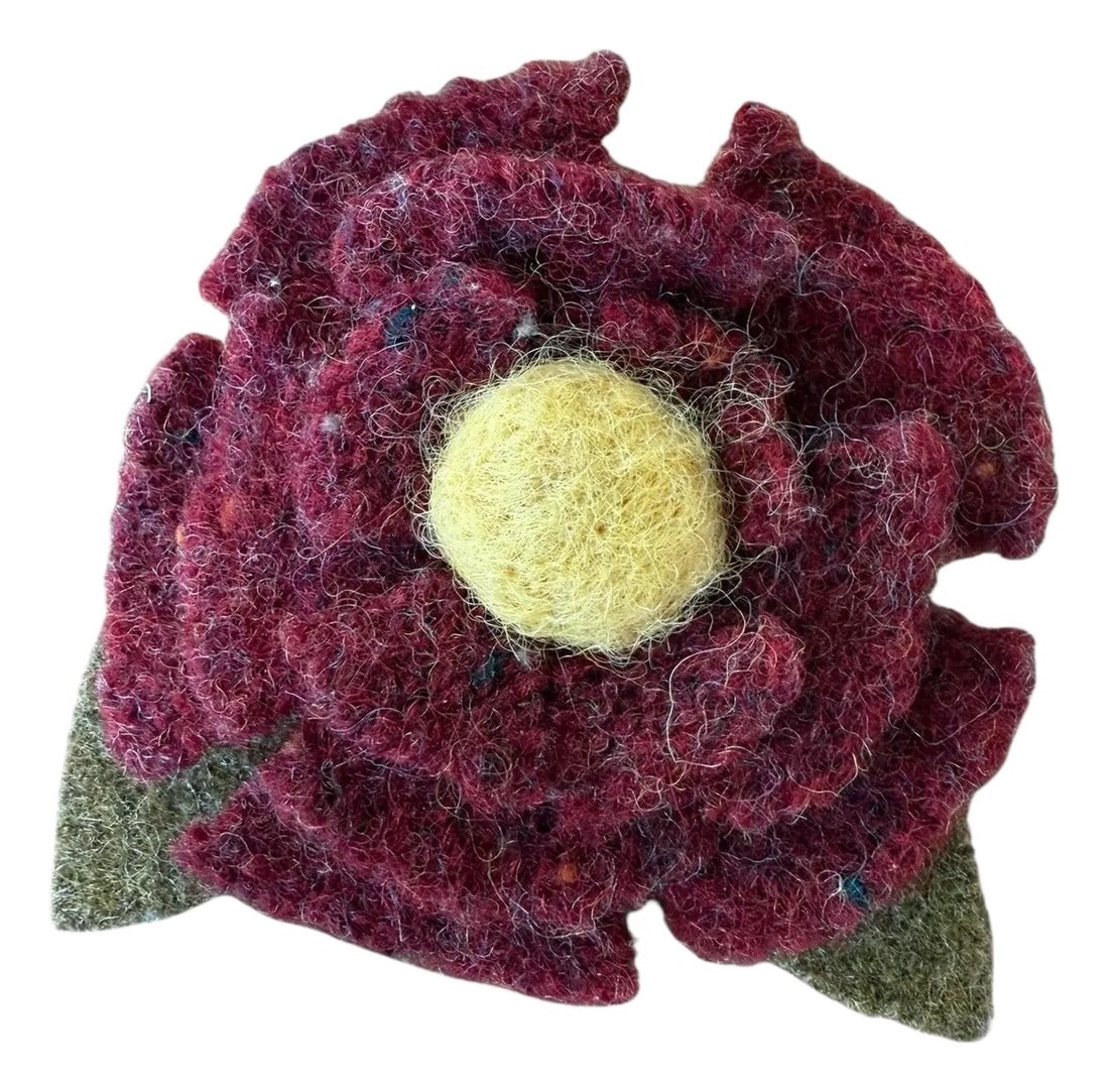 1990s Wool Felt Floral Folk Art Brooch: Organic Floral designed studio art brooch in wool felt. Folk art style. 3" round Hand stitched clasp pin. Layered maroon petals, yellow center atop a pair of olive green leaves. Beautiful pin