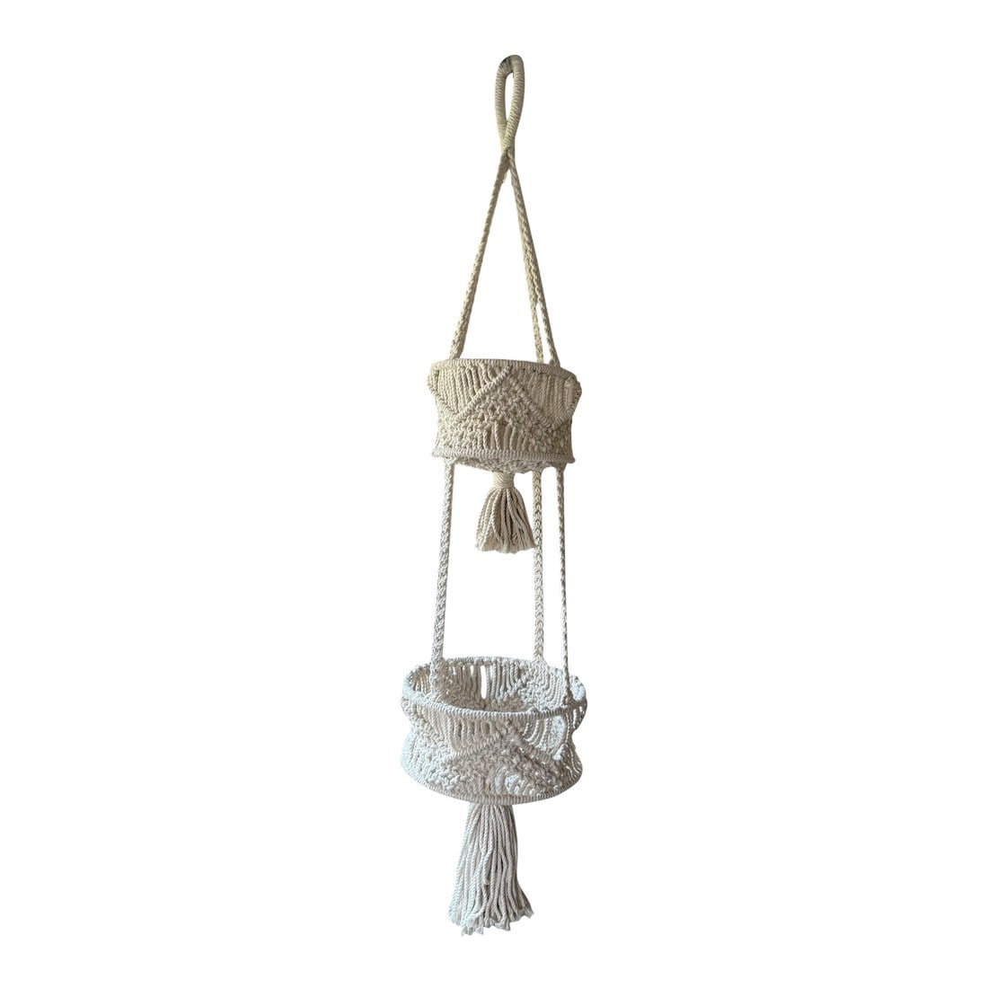Handwoven Cotton Macrame Tiered Plant Hanger: Handwoven vintage macrame tiered plant holder. Neutral cotton yarn in geometric design. 40" long including tassel x 4" deep baskets ring to ring with a 9" round bottom and 7" top plant holder. 