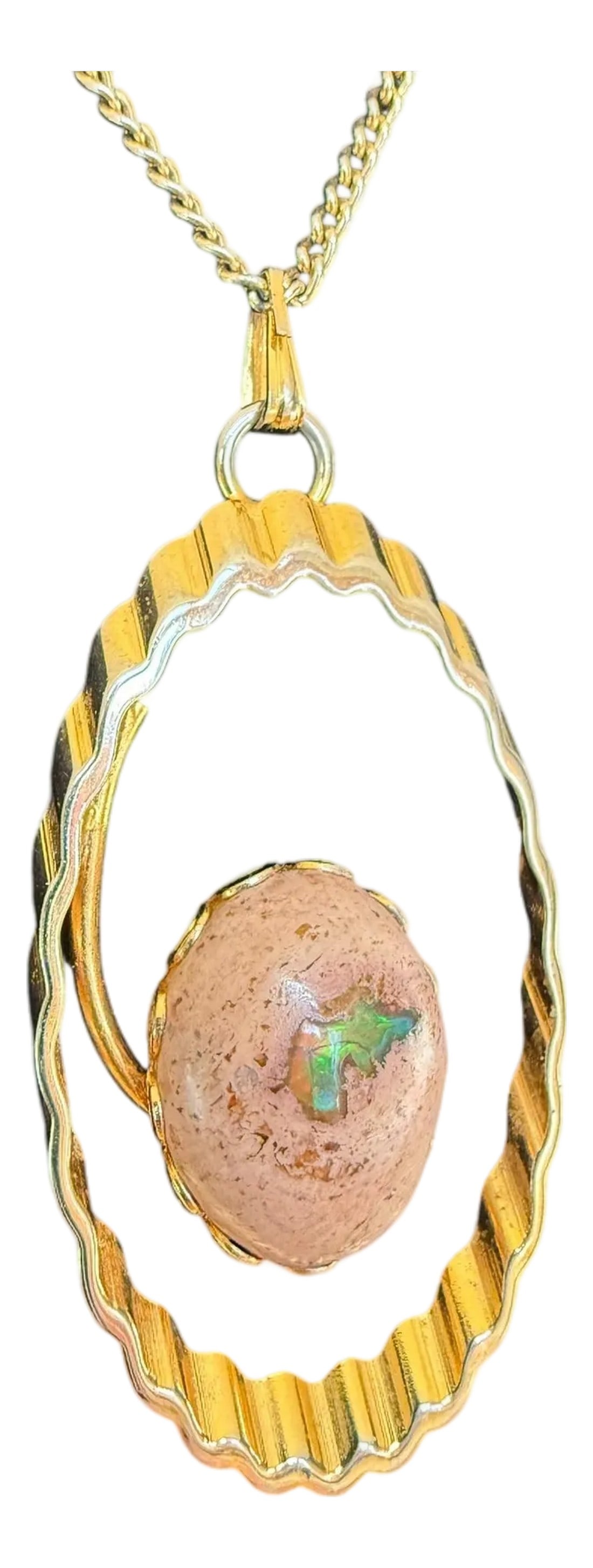 Mid 20th Century Mexican Cantera Fire Opal Pendant Necklace: Mexican Cantera Fire Opal Pendant Necklace The fire opal stone .75" long x.6" wide Gold-toned metal with spring clasp Pendant 1.75" long x 1" wide With chain 11" long Unmarked Mexican Cantera Fire Opa