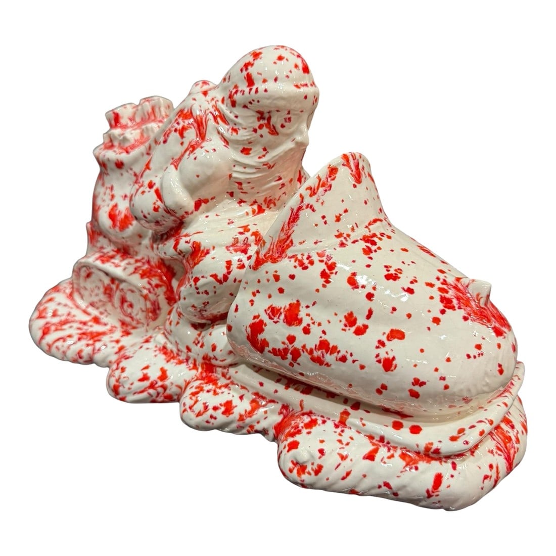Vintage Splatterware Studio Art Ceramic Christmas Santa: 1970's studio arts and crafts ceramic mold glazed in red and white splatter-ware technique. Kitschy Santa wearing goggles riding snowmobile with wind blowing his beard back and a bag full of gifts.