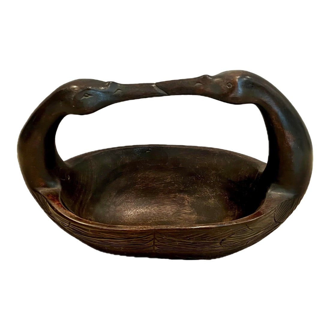 Late 20th Century Vintage Kissing Swans Wood Carved Basket: We love it for its simple form that conveys such a striking impression. Swans always bring a romantic feeling. The handle is sturdy and bowl is generous. The sides have nice feather carving. Made