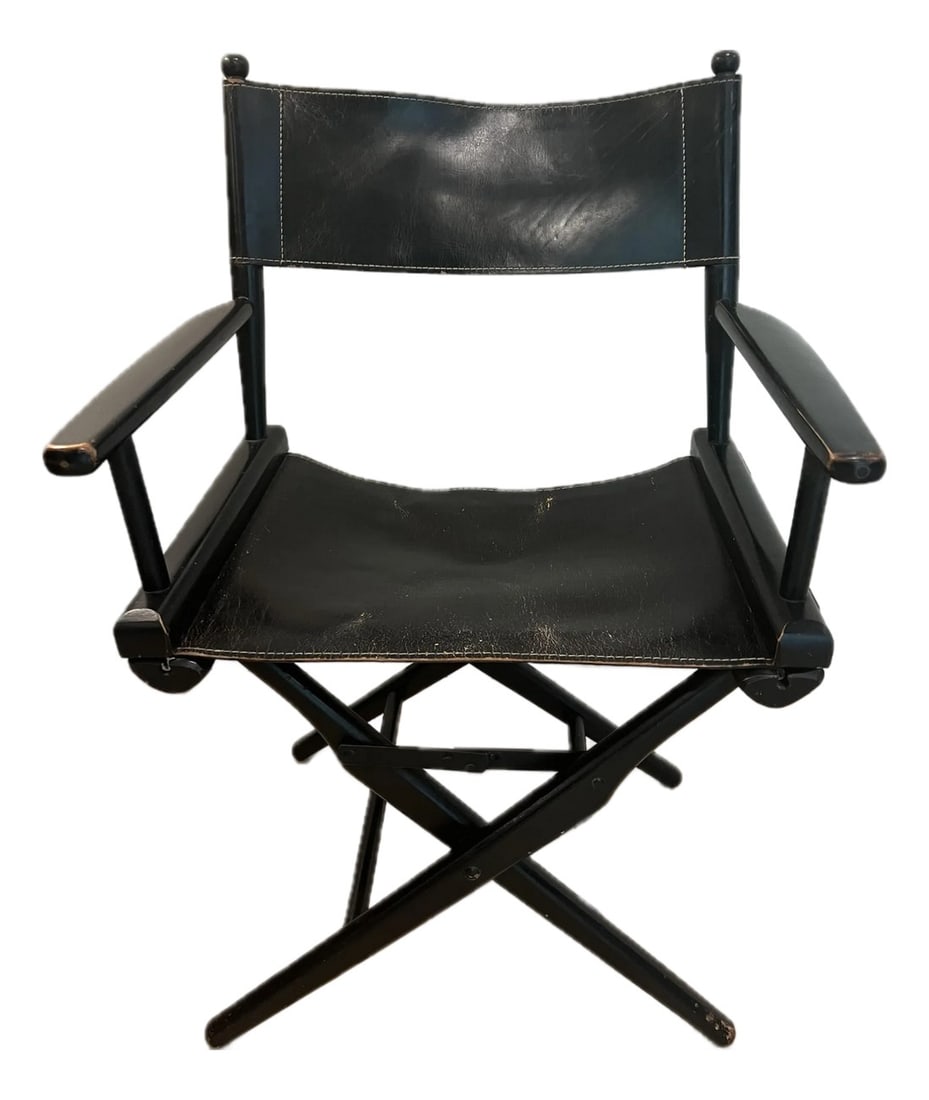 Vintage 1970's Director's Chair: Design icon. Bought in Greenwich Village NYC in 1980 this "˜70's campaign style Director's Chair is timeless class and comfort. The leather and side arms have a warm inviting patina. Foldable