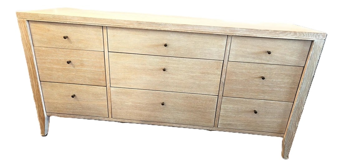 Dear Keaton Kira Oak Dresser: The brand is Dear Keaton -- This versatile French inspired dresser features nine roomy storage drawers with cerused oak veneer interiors, soft closing glides, and petite bronze pulls. Gradually
