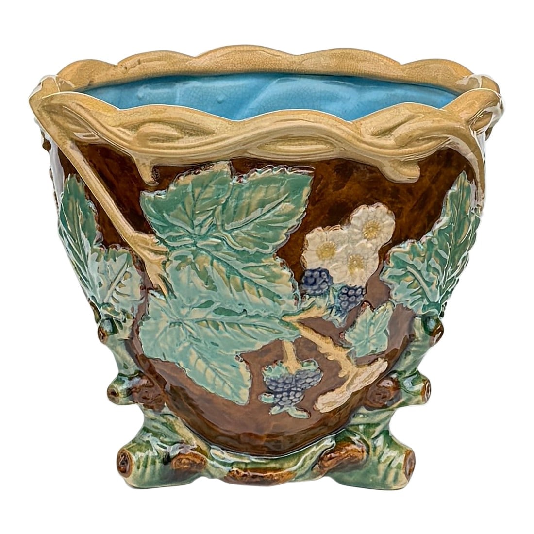 Antique Majolica Faux Bois Ceramic Jardiniere, Japan: A richly glazed majolica jardinière, featuring deeply modeled leaves, vines, and berries in high relief. The naturalistic motif wraps around the vessel, framed by a twisted vine rim and