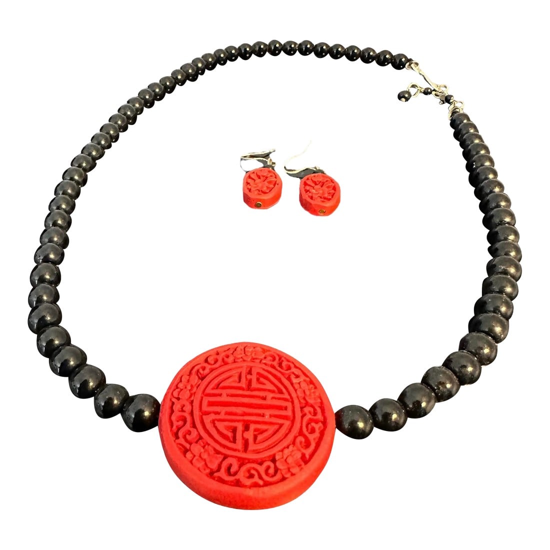 Vintage Hand Carved Cinnabar-Style Chinese Pendant Necklace With Black Onyx Glass Beads and Matching: Vintage 1990's Cinnabar-Style Necklace and Matching Earrings Set. From my personal collection-given by family who lived in China. Hand carved and crafted jewelry set. The character is a stylized