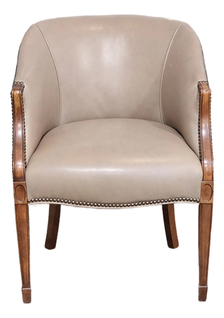Late 20th Century Taupe Leather Club Chair With Mahogany Frame: Store Item: Taupe Leather Club Chair with Mahogany Frame Description: Comfortable Mahogany Framed Club Chair with padded seat back and cushion resting on tapered legs terminating in dart feet. Upholst